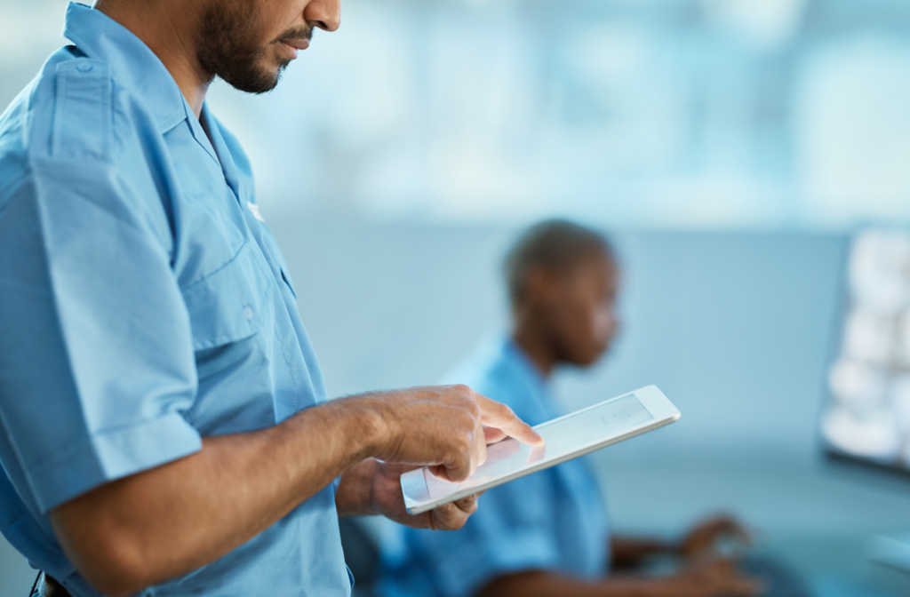 security guards using a tablet and computer